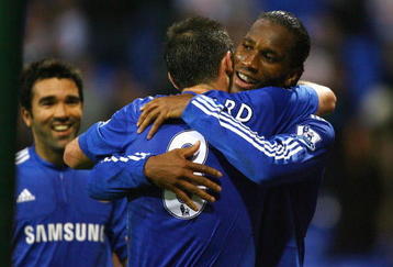 BOLTON, ENGLAND - OCTOBER 31:  Didier Drogba of Chelsea celebrates with Frank Lampard after scoring the fourth goal during the Barclays Premier League match between Bolton Wanderers and Chelsea at the Reebok Stadium on October 31, 2009 in Bolton,United Kingdom.  (Photo by Alex Livesey/Getty Images)