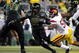 EUGENE, OR - OCTOBER 31: Running back LaMichael James #21 of the Oregon Ducks breaks through the line for a good gain in the third quarter of the game against the USC Trojans at Autzen Stadium on October 31, 2009 in Eugene, Oregon. James ran for 183 yards and a score as the Ducks upset the Trojans 47-20. (Photo by Steve Dykes/Getty Images)