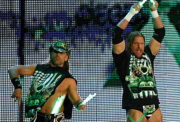 LAS VEGAS - AUGUST 24:  Wrestlers and tag team partners Shawn Michaels (L) and Triple H are introduced during the WWE Monday Night Raw show at the Thomas & Mack Center August 24, 2009 in Las Vegas, Nevada.  (Photo by Ethan Miller/Getty Images)
