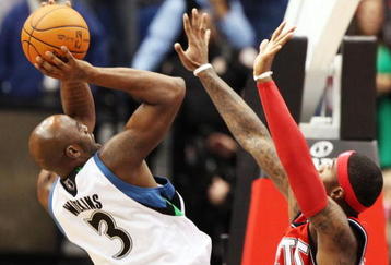 MINNEAPOLIS, MN - OCTOBER 28: Damien Wilkins #3 of the Minnesota Timberwolves scores the game-winning shot at the buzzer over Terrence Williams #8 of the New Jersey Nets at the Target Center on October 28, 2009 in Minneapolis, Minnesota. The Timberwolves defeated the Nets 95-93. (Photo by Genevieve Ross/Getty Images)