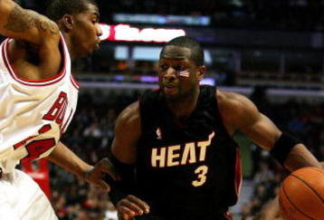 CHICAGO - FEBRUARY 12: Dwyane Wade #3 of the Miami Heat drives between Tyrus Thomas #24 and Ben Gordon #7 of the Chicago Bulls on February 12, 2009 at the United Center in Chicago, Illinois. The Heat defeated the Bulls 95-93. NOTE TO USER: User expressly acknowledges and agreees that, by downloading and/or using this Photograph, User is consenting to the terms and conditions of the Getty Images License Agreement. (Photo by Jonathan Daniel/Getty Images)