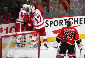 CALGARY, CANADA - OCTOBER 31:   Mike Eaves #17, Darren Helm, and Todd Bertuzzi #44 of the Detroit Red Wings celebrate teammate Brad Stuart's #23 second period Goal against  Miikka Kiprusoff #34 the Calgary Flames on October 31st, 2009 at the Pengrowth Saddledome in Calgary, Alberta, Canada. (Photo by Dale MacMillan/Getty Images)