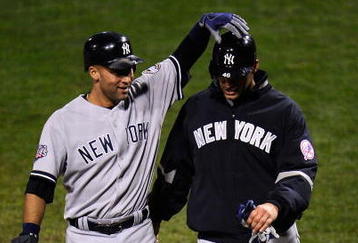 PHILADELPHIA - OCTOBER 31:  Derek Jeter #2 of the New York Yankees celebrates scoring in the fifth inning on a Johnny Damon double with Andy Pettitte #46 against the Philadelphia Phillies in Game Three of the 2009 MLB World Series at Citizens Bank Park on October 31, 2009 in Philadelphia, Pennsylvania.  (Photo by Jeff Zelevansky/Getty Images)