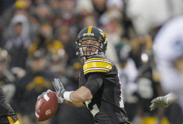 IOWA CITY, IOWA - NOVEMBER 8: Quarterback Ricky Stanzi #12 of the Iowa Hawkeyes looks down field for a receiver during the fourth quarter of play against the Penn State Nittany Lions at Kinnick Stadium on November 8, 2008 in Iowa City, Iowa. Iowa defeated Penn State  24-23. (Photo by David Purdy/Getty Images)