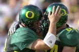 01 Sep 2001: Quarterback Joey Harrington #3 (L) of the Oregon Ducks congratulates teammate Justin Peelle for scoring a touchdown against the Wisconsin Badgers during the Pac-10 game at Autzen Stadium in Eugene, Orgeon.  Oregon won 31-28. DIGITAL IMAGE. Mandatory Credit: Otto Greule/Allsport