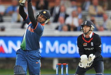 LONDON, ENGLAND - JUNE 14: Yuvraj Singh of India hits out watched by James Foster of England during the ICC World Twenty20 Super Eights match between England and India at Lord's on June 14, 2009 in London, England.  (Photo by Christopher Lee/Getty Images)
