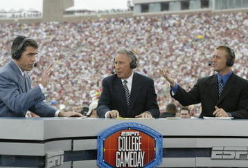 TALLAHASSEE, FL - OCTOBER 26:  ESPN College GameDay announcers (l to r) Chris Fowler, Lee Corso and Kirk Herbstreit comment during the NCAA football game between Notre Dame and Florida State at Doak Campbell Stadium on October 26, 2002 in Tallahassee, Florida.  The Notre Dame Fighting Irish defeated the Florida State Seminoles 34-24.  (Photo by Craig Jones/Getty Images)