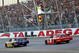 TALLADEGA, AL - NOVEMBER 01: Jamie McMurray, driver of the #26 IRWIN Marathon Ford, takes the checkered flag ahead of second place finisher Kasey Kahne, driver of the #9 Budweiser Dodge to win the NASCAR Sprint Cup Series AMP Energy 500 at Talladega Superspeedway on November 1, 2009 in Talladega, Alabama.  (Photo by Jerry Markland/Getty Images for NASCAR)
