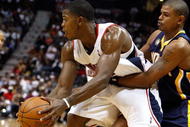 ATLANTA - OCTOBER 28:  Joe Johnson #2 of the Atlanta Hawks controls the ball against Earl Watson #2 of the Indiana Pacers at Philips Arena on October 28, 2009 in Atlanta, Georgia.  (Photo by Kevin C. Cox/Getty Images)