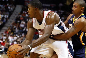 ATLANTA - OCTOBER 28:  Joe Johnson #2 of the Atlanta Hawks controls the ball against Earl Watson #2 of the Indiana Pacers at Philips Arena on October 28, 2009 in Atlanta, Georgia.  (Photo by Kevin C. Cox/Getty Images)