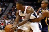 ATLANTA - OCTOBER 28:  Joe Johnson #2 of the Atlanta Hawks controls the ball against Earl Watson #2 of the Indiana Pacers at Philips Arena on October 28, 2009 in Atlanta, Georgia.  (Photo by Kevin C. Cox/Getty Images)