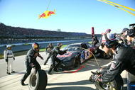 TALLADEGA, AL - NOVEMBER 01: Brian Vickers, driver of the #83 Red Bull Toyota, makes a pit stop during the NASCAR Sprint Cup Series AMP Energy 500 at Talladega Superspeedway on November 1, 2009 in Talladega, Alabama. (Photo by Jerry Markland/Getty Images for NASCAR)