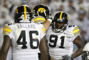 STATE COLLEGE, PA - SEPTEMBER 26:  Broderick Binns #91 of the Iowa Hawkeye's celebrates a second quarter safty with Christian Ballard #46 in front of Dennis Landolt #73 of the Penn State Nittnay Lions on September 26, 2009 at Beaver Stadium in State College, Pennsylvania. (Photo by Gregory Shamus/Getty Images)