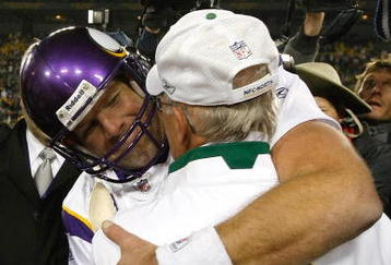 GREEN BAY, WI - NOVEMBER 1: Quarterback Brett Favre #4 of the Minnesota Vikings hugs a Packers coach after the game against the Green Bay Packers at Lambeau Field on November 1, 2009 in Green Bay, Wisconsin. The Vikings defeated the Packers 38-26. (Photo by Scott Boehm/Getty Images)