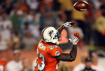 MIAMI - OCTOBER 12:  Running back Ronnie Brown #23 of the Miami Dolphins throws a pass against the New York Jets at Land Shark Stadium on October 12, 2009 in Miami, Florida. The Dolphins defeated the Jets 31-27.  (Photo by Doug Benc/Getty Images)