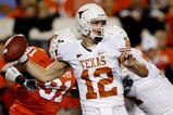 STILLWATER, OK - OCTOBER 31:  Quarterback Colt McCoy #12 of the Texas Longhorns goes back for a pass in the first quarter against the Oklahoma State Cowboys at Boone Pickens Stadium on October 31, 2009 in Stillwater, Oklahoma.  (Photo by Ronald Martinez/Getty Images)