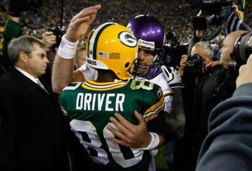 GREEN BAY, WI - NOVEMBER 1: Quarterback Brett Favre #4 of the Minnesota Vikings hugs a Donald Driver #80 of the Green Bay Packers at Lambeau Field on November 1, 2009 in Green Bay, Wisconsin. The Vikings defeated the Packers 38-26. (Photo by Scott Boehm/Getty Images)