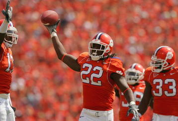 CLEMSON, SC - SEPTEMBER 23:  Chris Clemons #22 of the Clemson Tigers holds up the ball after a defensive play during their game against the University of North Carolina Tar Heels on September 23, 2006 at Memorial Stadium in Clemson, South Carolina. (Photo By Streeter Lecka/Getty Images)