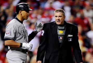 PHILADELPHIA - NOVEMBER 01:  Alex Rodriguez #13 of the New York Yankees talks with home plate umpire Mike Everitt #57 after Rodriguez was hit by a pitch in the top of the first inning against the Philadelphia Phillies in Game Four of the 2009 MLB World Series at Citizens Bank Park on November 1, 2009 in Philadelphia, Pennsylvania.  (Photo by Jeff Zelevansky/Getty Images)