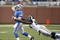 DETROIT , MI - NOVEMBER 01:  Mathew Stafford #9 of the Detroit Lions tries to get a pass of before being tackled by James Hall #96 of the St. Louis Rams on November 1, 2009 at Ford Field in Detroit, Michigan.  (Photo by Gregory Shamus/Getty Images)