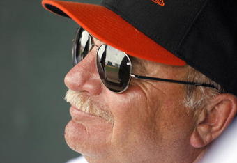 FT. LAUDERDALE, FL - MARCH 2: Pitching Coach Leo Mazzone #54 of the Baltimore Orioles smiles in the dugout against the Florida Marlins at Ft. Lauderdale Stadium during spring training March 2, 2007 in Ft. Lauderdale, Florida. (Photo by Marc Serota/Getty Images)