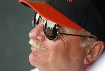 FT. LAUDERDALE, FL - MARCH 2: Pitching Coach Leo Mazzone #54 of the Baltimore Orioles smiles in the dugout against the Florida Marlins at Ft. Lauderdale Stadium during spring training March 2, 2007 in Ft. Lauderdale, Florida. (Photo by Marc Serota/Getty Images)