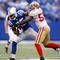 INDIANAPOLIS - NOVEMBER 01:  Pierre Garcon #85 of the Indianapolis Colts is tackled by Patrick Willis #52 of the San Francisco 49ers during the NFL game at Lucas Oil Stadium on November 1, 2009 in Indianapolis, Indiana. The Colts won 18-14.  (Photo by Andy Lyons/Getty Images)