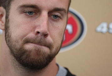 SANTA CLARA, CA - MAY 01:  Quarterback Alex Smith #11 of the San Francisco 49ers talks with the media during the 49ers Minicamp at their training facilities on May 1, 2009 in Santa Clara, California.  (Photo by Jed Jacobsohn/Getty Images)