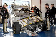 TALLADEGA, AL - NOVEMBER 01:  Crew chief Tony Gibson (L) looks over the #39 U.S Army Chevrolet, driven by Ryan Newman, in the garage after a car incident on track during the NASCAR Sprint Cup Series AMP Energy 500 at Talladega Superspeedway on November 1, 2009 in Talladega, Alabama.  (Photo by Rusty Jarrett/Getty Images for NASCAR)