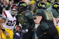 EUGENE, OR - OCTOBER 31: Running back LaMichael James #21 of the Oregon Ducks breaks through the line for a touchdown in the third quarter of the game against the USC Trojans at Autzen Stadium on October 31, 2009 in Eugene, Oregon. James ran for 183 yards and a score as the Ducks upset the Trojans 47-20. (Photo by Steve Dykes/Getty Images)