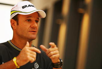 ABU DHABI, UNITED ARAB EMIRATES - OCTOBER 29:  Rubens Barrichello of Brazil and Brawn GP is interviewed in the paddock during previews to the Abu Dhabi Formula One Grand Prix at the Yas Marina Circuit on October 29, 2009 in Abu Dhabi, United Arab Emirates.  (Photo by Paul Gilham/Getty Images)