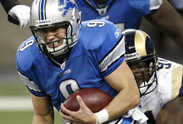 DETROIT , MI - NOVEMBER 01:  Matthew Stafford #9 of the Detroit Lions is tackled by Leonard Little #91 of the St. Louis Rams on November 1, 2009 at Ford Field in Detroit, Michigan.  (Photo by Gregory Shamus/Getty Images)