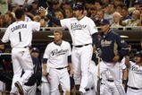 SAN DIEGO, CA - SEPTEMBER 30:  Everth Cabrera #1 of the San Diego Chargers is congratulated on scoring after being called to home by the umpire after third-baseman Mark Loretta #5 of the Los Angeles Dodgers impeded his movement with his legs during the MLB game between the Los Angeles Dodger and the San Diego Padres at Petco Park on September 30, 2009 in San Diego, California. (Photo by Donald Miralle/Getty Images)
