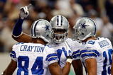 ARLINGTON, TX - NOVEMBER 01:  Wide receiver Roy Williams #11 celebrates a touchdown with Patrick Crayton #84 and Miles Austin #18 of the Dallas Cowboys at Cowboys Stadium on November 1, 2009 in Arlington, Texas.  (Photo by Ronald Martinez/Getty Images)