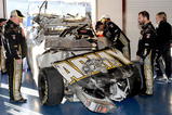 TALLADEGA, AL - NOVEMBER 01:  Crew chief Tony Gibson (L) looks over the #39 U.S Army Chevrolet, driven by Ryan Newman, in the garage after a car incident on track during the NASCAR Sprint Cup Series AMP Energy 500 at Talladega Superspeedway on November 1, 2009 in Talladega, Alabama.  (Photo by Rusty Jarrett/Getty Images for NASCAR)