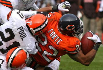 CHICAGO - NOVEMBER 01: Matt Forte #22 of the Chicago Bears is tackled by Kamerion Wimbley #95, Brodney Pool #21 and Kaluka Maiava #56 of the Cleveland Browns at Soldier Field on November 1, 2009 in Chicago, Illinois. The Bears defeated the Browns 30-6. (Photo by Jonathan Daniel/Getty Images)