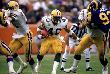 ANAHEIM, CA - 1986:  Running back Eddie Lee Ivery #40 of the Green Bay Packers runs through the hole against the Los Angeles Rams durng the 1986 NFL season at Anaheim Stadium in Anaheim, California.  (Photo by Stephen Dunn/Getty Images)  