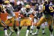 ANAHEIM, CA - 1986: Running back Eddie Lee Ivery #40 of the Green Bay Packers runs through the hole against the Los Angeles Rams durng the 1986 NFL season at Anaheim Stadium in Anaheim, California. (Photo by Stephen Dunn/Getty Images)