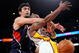 LOS ANGELES, CA - NOVEMBER 01:  Kobe Bryant #24 (R)  of the Los Angeles Lakers is fouled by Zaza Pachulia #27 of the Atlanta Hawks during the NBA basketball game at Staples Center on November 1, 2009 in Los Angeles, California. NOTE TO USER: User expressly acknowledges and agrees that, by downloading and/or using this Photograph, user is consenting to the terms and conditions of the Getty Images License Agreement.  (Photo by Kevork Djansezian/Getty Images)