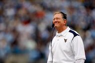 CHARLOTTE, NC - DECEMBER 27: Head coach Bill Stewart of the West Virginia Mountaineers looks at the scoreboard during their game against the North Carolina Tar Heels at Bank of America Stadium on December 27, 2008 in Charlotte, North Carolina. (Photo by Streeter Lecka/Getty Images)