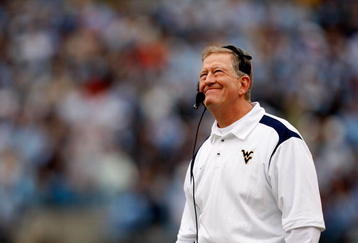 CHARLOTTE, NC - DECEMBER 27:  Head coach Bill Stewart of the West Virginia Mountaineers looks at the scoreboard during their game against the North Carolina Tar Heels at Bank of America Stadium on December 27, 2008 in Charlotte, North Carolina.  (Photo by Streeter Lecka/Getty Images)