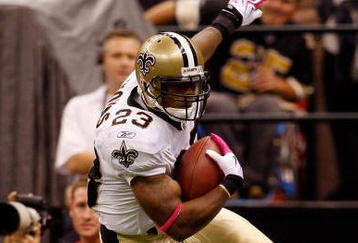NEW ORLEANS - OCTOBER 04:  Pierre Thomas #23 of the New Orleans Saints avoids a tackle by Dwight Lowery #21 of the New York Jets at the Louisana Superdome on October 4, 2009 in New Orleans, Louisiana.  (Photo by Chris Graythen/Getty Images)