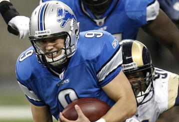 DETROIT , MI - NOVEMBER 01:  Matthew Stafford #9 of the Detroit Lions is tackled by Leonard Little #91 of the St. Louis Rams on November 1, 2009 at Ford Field in Detroit, Michigan.  (Photo by Gregory Shamus/Getty Images)