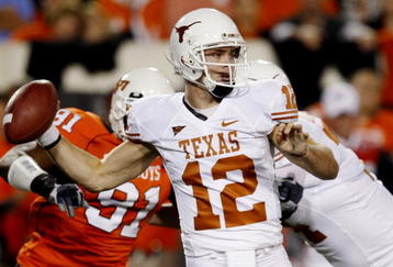 STILLWATER, OK - OCTOBER 31:  Quarterback Colt McCoy #12 of the Texas Longhorns goes back for a pass in the first quarter against the Oklahoma State Cowboys at Boone Pickens Stadium on October 31, 2009 in Stillwater, Oklahoma.  (Photo by Ronald Martinez/Getty Images)
