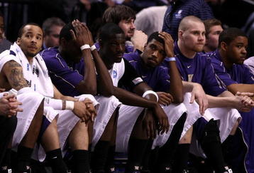 PORTLAND, OR - MARCH 21:  (L) Venoy Overton #1 of the Washington Huskies along with the rest of the Huskies bench react late in the second half before losing to the Purdue Boilermakers during the second round of the NCAA Division I Men's Basketball Tournament at the Rose Garden on March 21, 2009 in Portland, Oregon. The Boilermakers defeated the Huskies 76-74 to advance to the Sweet 16.  (Photo by Jonathan Ferrey/Getty Images)