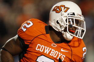 STILLWATER, OK - OCTOBER 31:  Running back Beau Johnson #2 of the Oklahoma State Cowboys celebrates his touchdown in the second quarter of the game against the Texas Longhorns at Boone Pickens Stadium on October 31, 2009 in Stillwater, Oklahoma.  (Photo by Ronald Martinez/Getty Images)