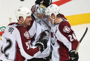 CALGARY, CANADA - OCTOBER 28:  Craig Anderson #41 of the Colorado Avalanche is congratulated by teammates Adam Foote #52 and Paul Stastny #26 following their team's 10th win of the season against the Calgary Flames on October 28, 2009 at the Pengrowth Saddledome in Calgary, Alberta, Canada. (Photo by Dale MacMillan/Getty Images)