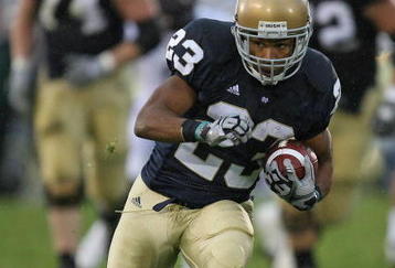 SOUTH BEND, IN - OCTOBER 03: Golden Tate #23 of the Notre Dame Fighting Irish runs against the Washington Huskies on his way to a 67 yard touchdown on October 3, 2009 at Notre Dame Stadium in South Bend, Indiana. (Photo by Jonathan Daniel/Getty Images)