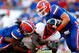 JACKSONVILLE, FL - OCTOBER 31: Brandon Spikes #51 and Duke Lemmens #44 of the Florida Gators tackle Washaun Ealey #24 of the Georgia Bulldogs at Jacksonville Municipal Stadium on October 31, 2009 in Jacksonville, Florida. (Photo by Kevin C. Cox/Getty Images)