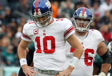 PHILADELPHIA - NOVEMBER 01:  Eli Manning #10 and Chris Snee #76 of the New York Giants stand on the field against the Philadelphia Eagles on November 1, 2009 at Lincoln Financial Field in Philadelphia, Pennsylvania.  (Photo by Jim McIsaac/Getty Images)